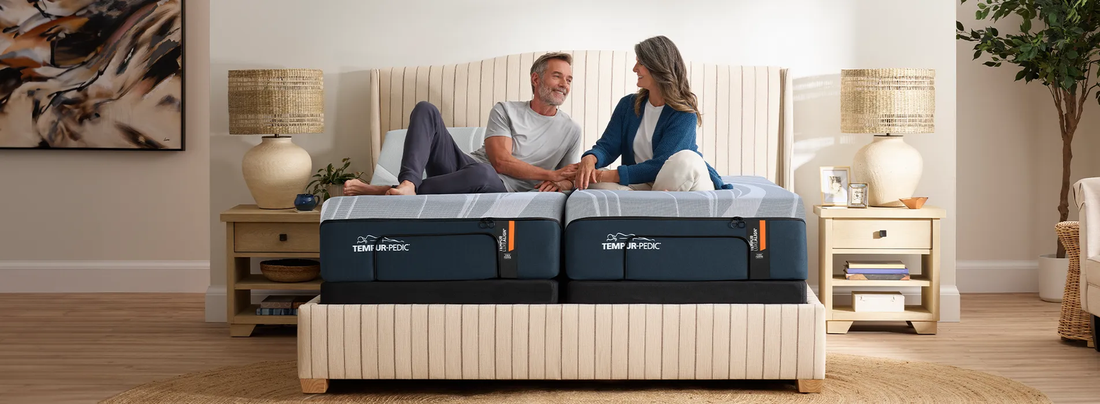 Couple relaxing on a Tempur-Pedic adjustable mattress demonstrating pressure relief and comfort